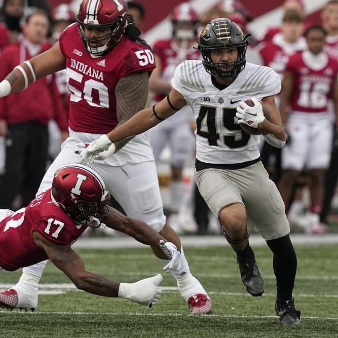 Purdue's Devin Mockobee runs past Indiana Jonathan Haynes.jpeg